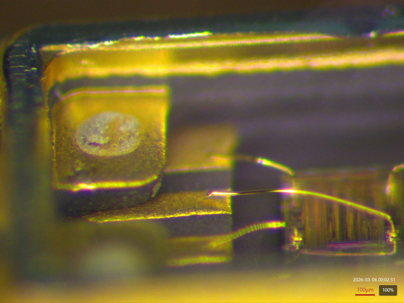 Broken bond wire seen under the stereo microscope