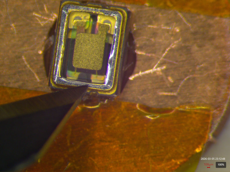 Preparing to pry the crystal out with a scalpel blade