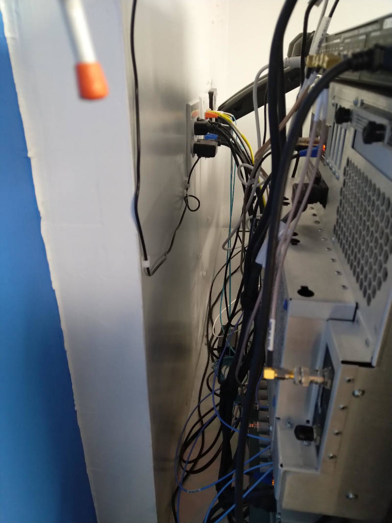 View behind one of my instrumentation racks showing tight quarters and lots of wiring