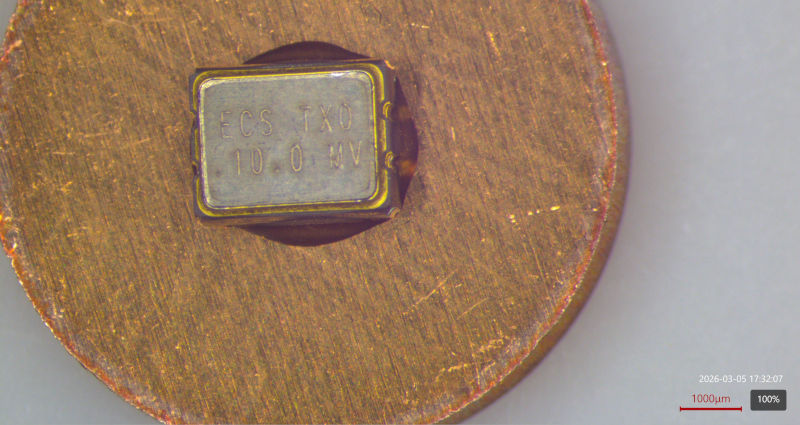 Top view of the TCXO mounted to a copper disk